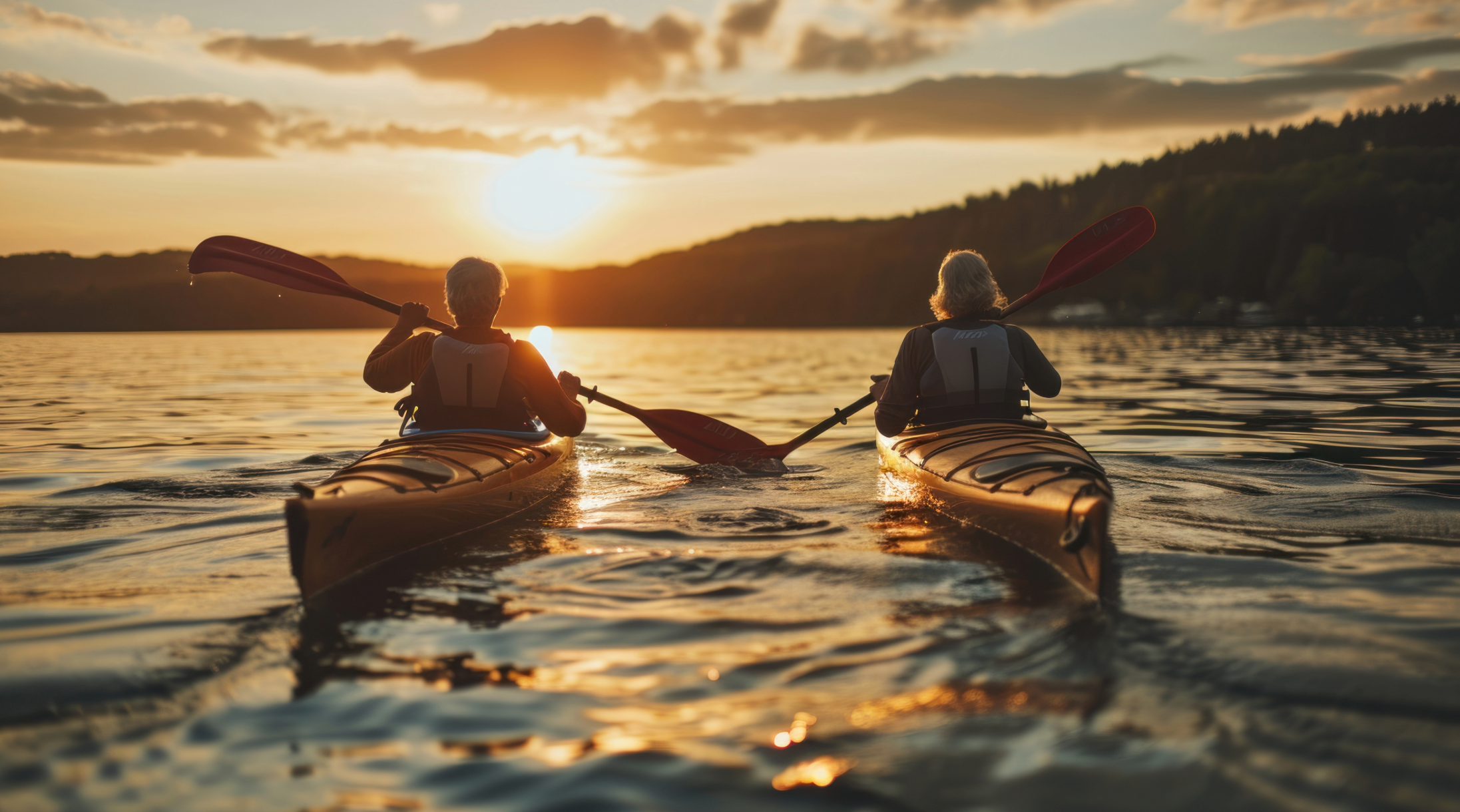  Picture of retired couple kayaking on a lake